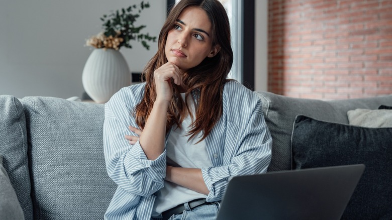 Lady appears lost in thought