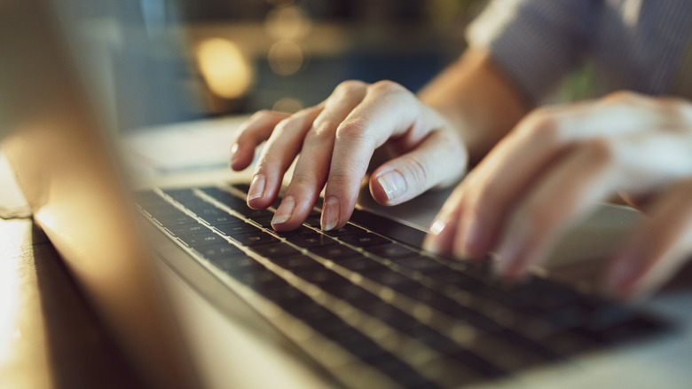 typing on laptop keyboard