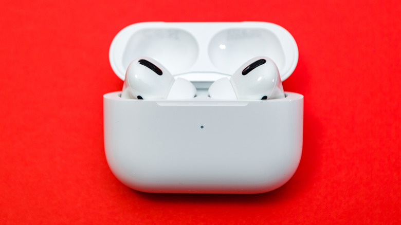 AirPods on red background