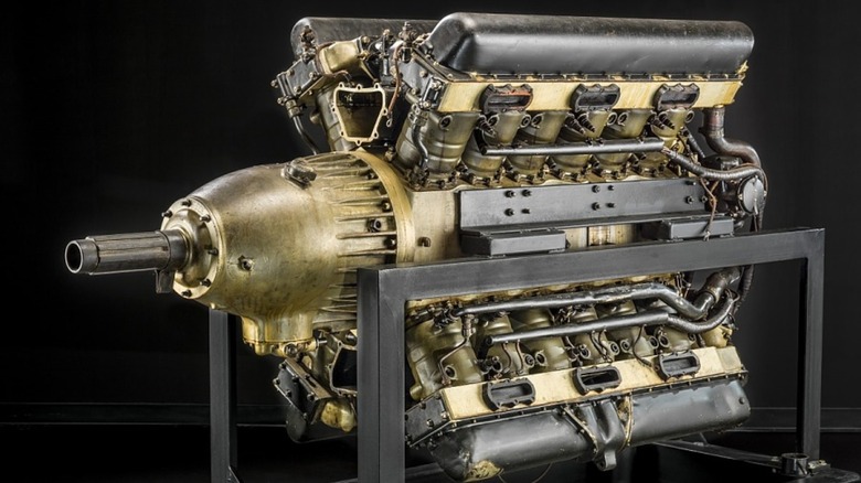 Packard X-2775 X-24 engine on a stand with a black background