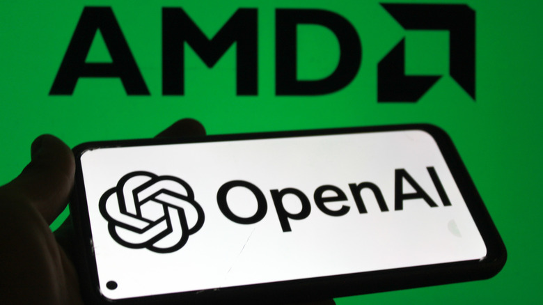 OpenAI logo on a smartphone screen and AMD logo in the background