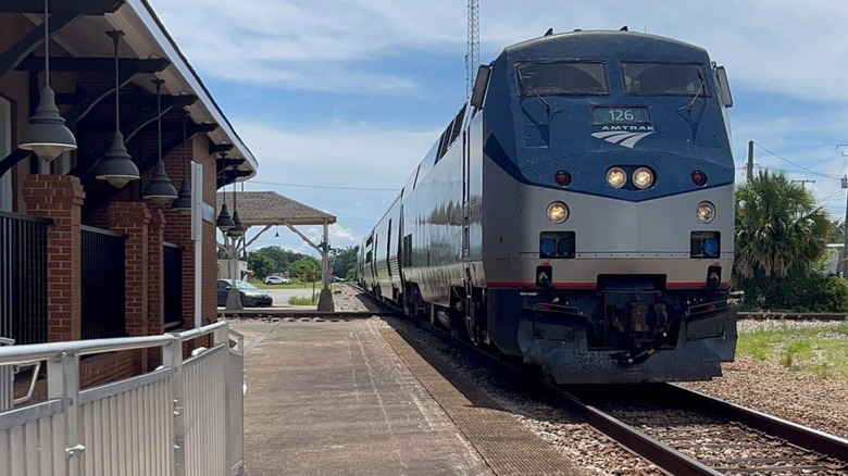 Amtrak Train arriving at a station along Mardi Gras Service route
