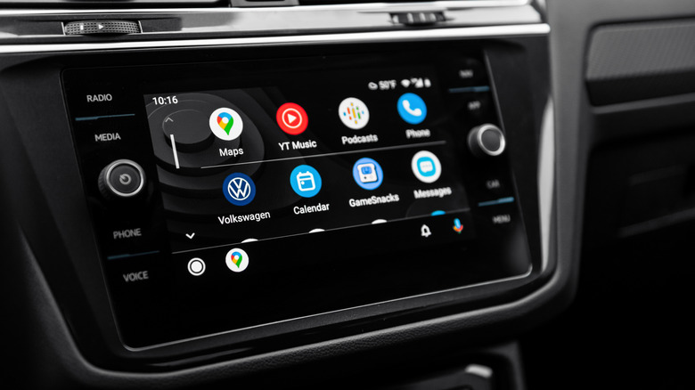 Close-up shot of infotainment system in Volkswagen car interior, featuring the Android Auto main menu.