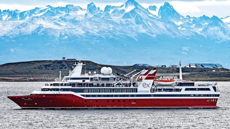 The Exploris One on open water with mountains in the background