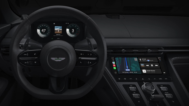 Wide shot of an Aston Martin interior featuring Apple CarPlay's new operating system