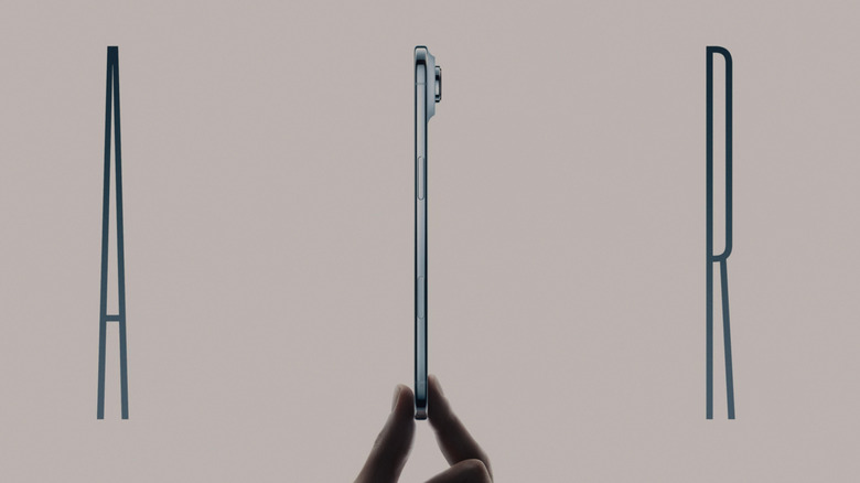 Fingers holding the iPhone 17 Air to show its thin profile
