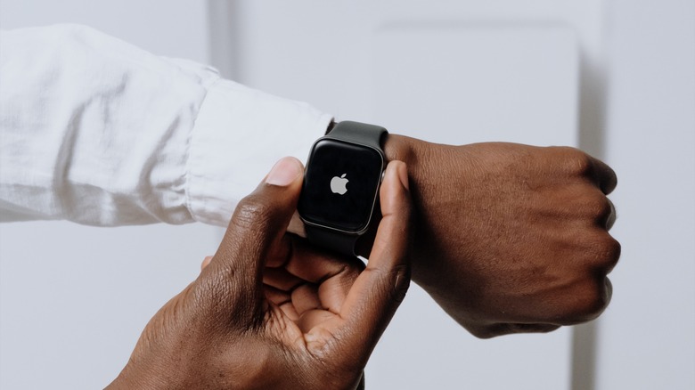 Man pressing Apple Watch digital crown
