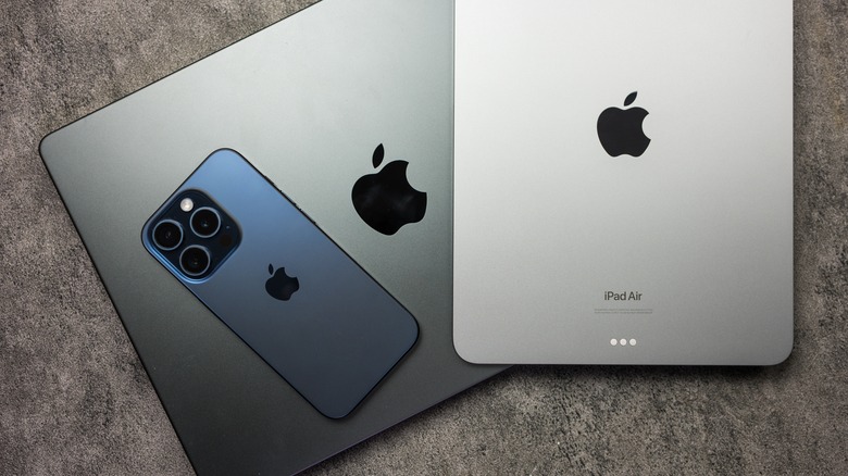 iPhone, iPad, and MacBook on a table