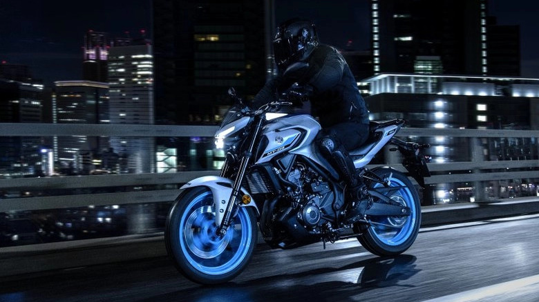 Yamaha MT-03 being ridden over a bridge
