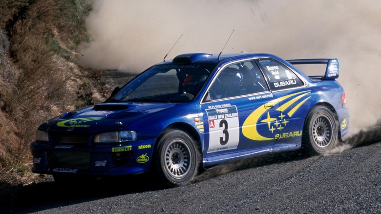 Front 3/4 view of a first generation Subaru WRX STI competing in the Rally New Zealand