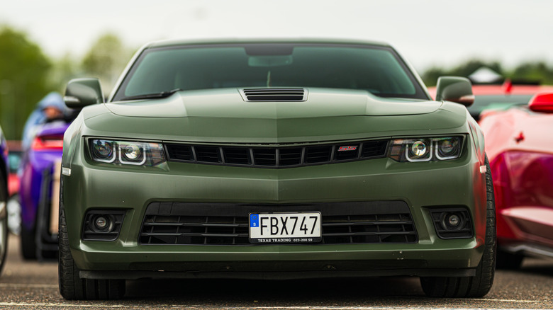 Chevrolet Camaro SS parked in lot, front-view low-angle