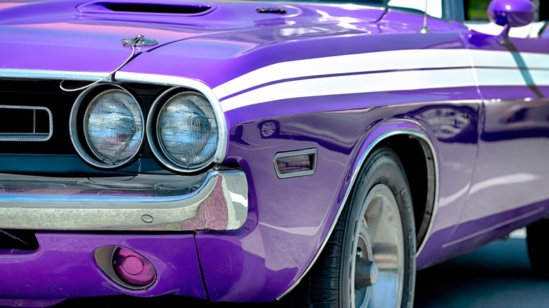 Close-up of a purple Dodge Challenger convertible at car show