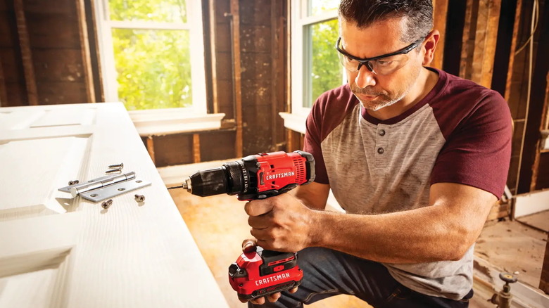 man using a Craftsman V20 half-inch cordless drill