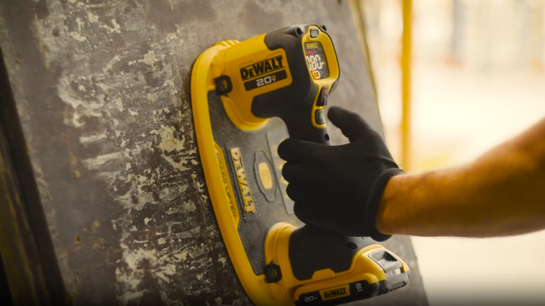 Using a DeWalt GRABO Lifter on a metal surface.