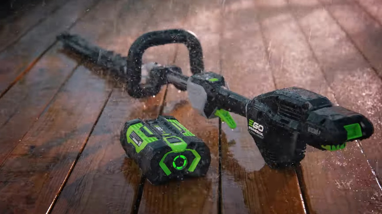 EGO hedge trimmer and battery out in the rain