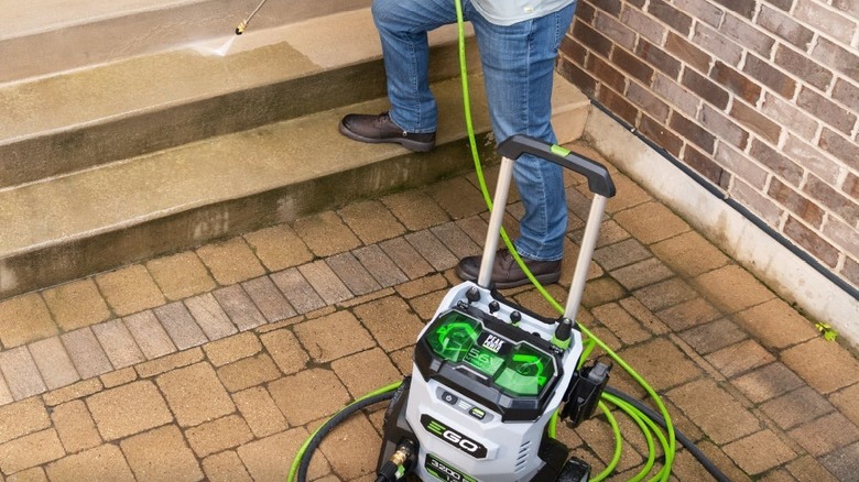 EGO pressure washer on wet surface