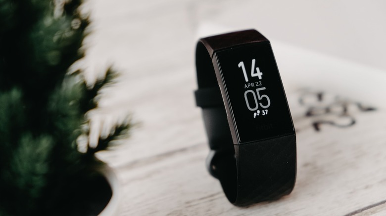 Fitbit Charge 4 fitness tracker on a table