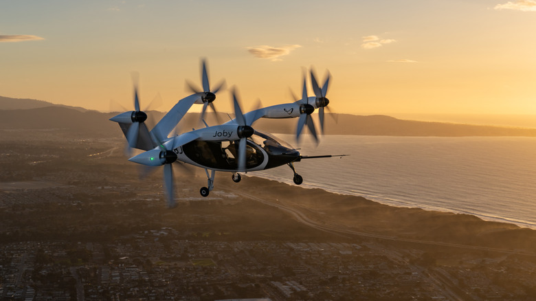 Joby aircraft flies above a city
