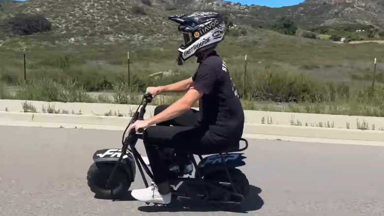 A rider on the FRP mini bike