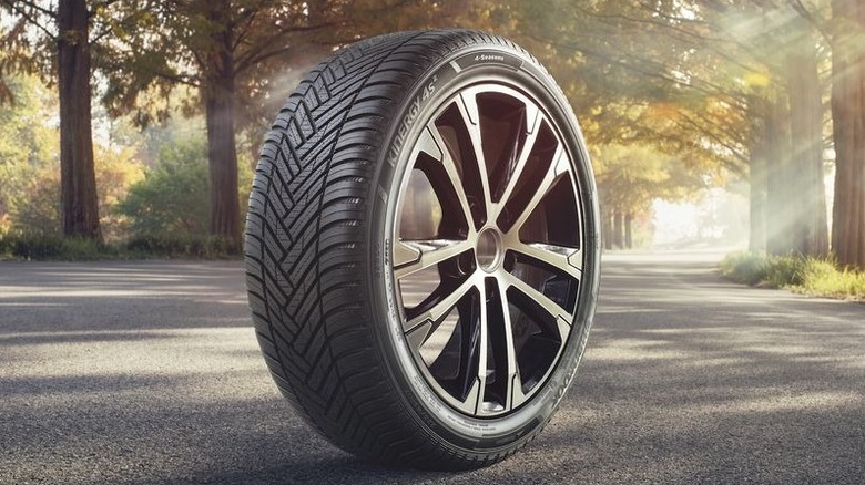 Hankook Kinergy tire and wheel on road in forested setting