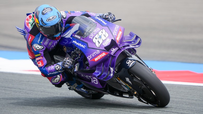 Purple superbike turning a corner in motogp