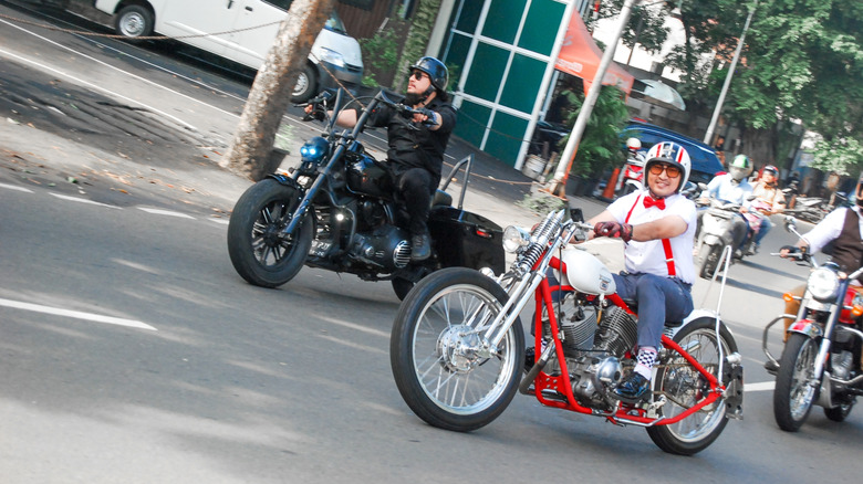 a custom motorcycle convoy on a city street