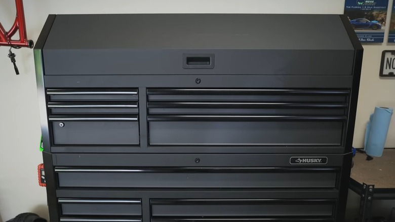 A black Husky tool chest in a garage