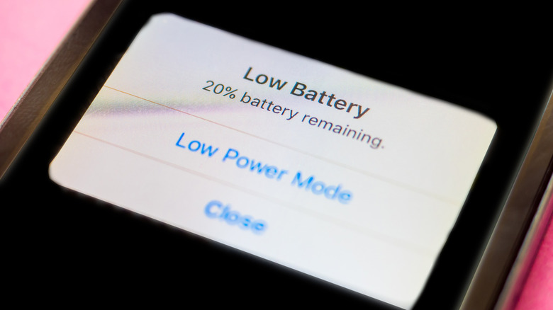 iPhone screen displaying low battery warning