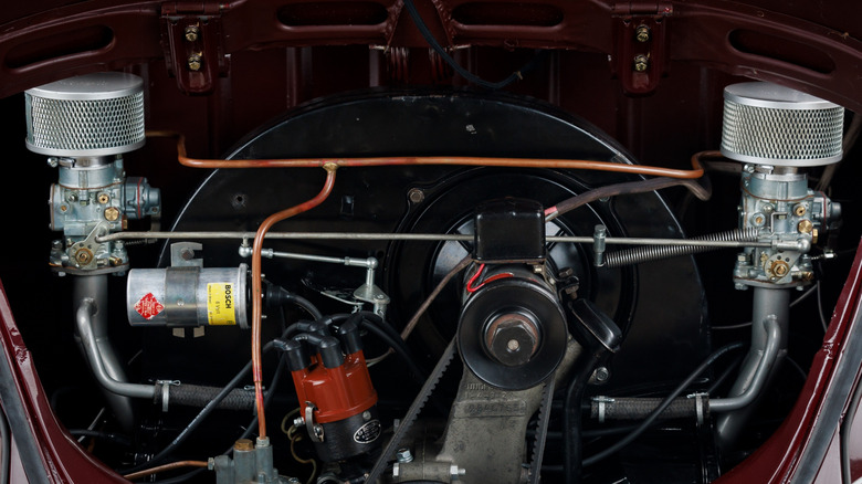 Engine bay of classic Volkswagen Beetle with aftermarket dual carburetors