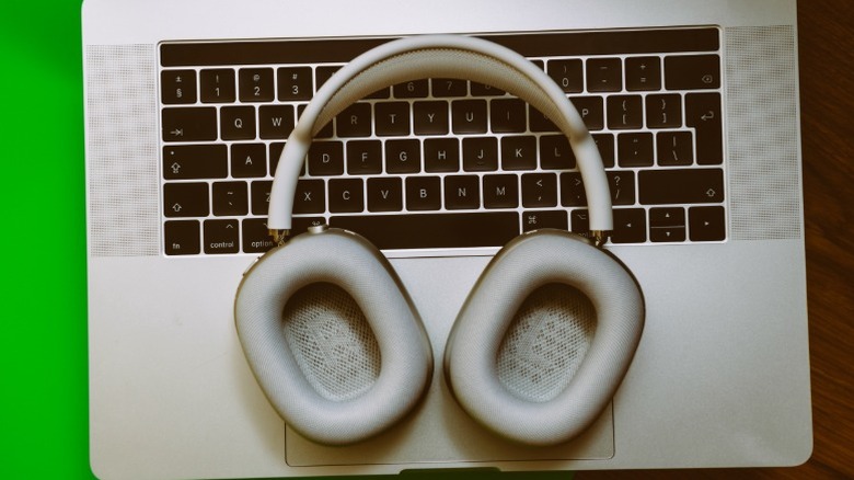 AirPods Max resting on a MacBook