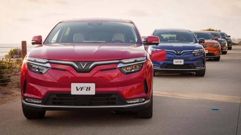 A row of VinFast VF8 cars at the launch press event