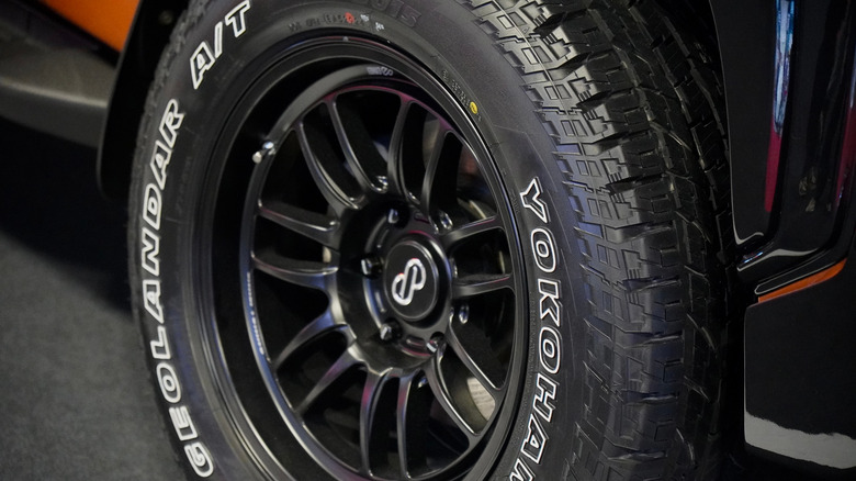 Yokohama Geolandar A/T white-outline letter tires on truck