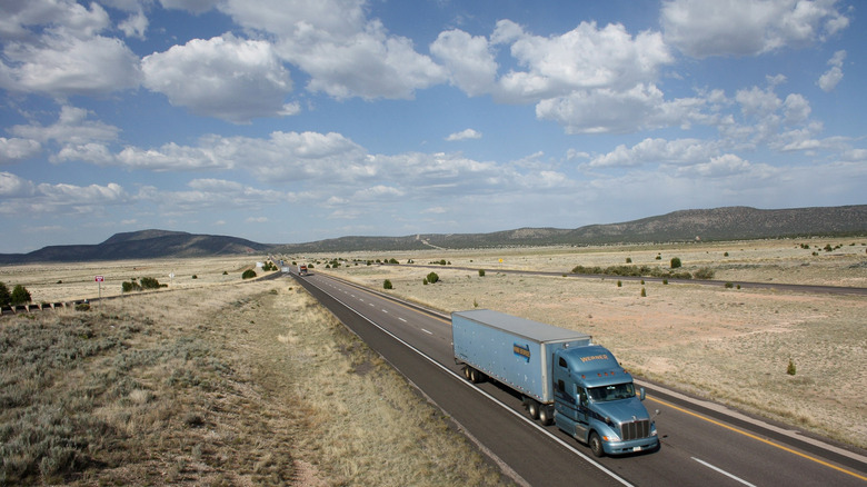 Vehicles on I-40 somewhere in the desert of Arizona.