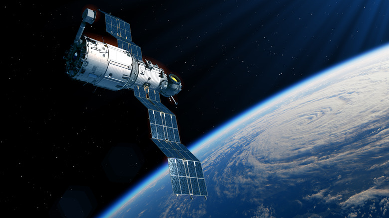 A rendering of a satellite orbiting Earth.