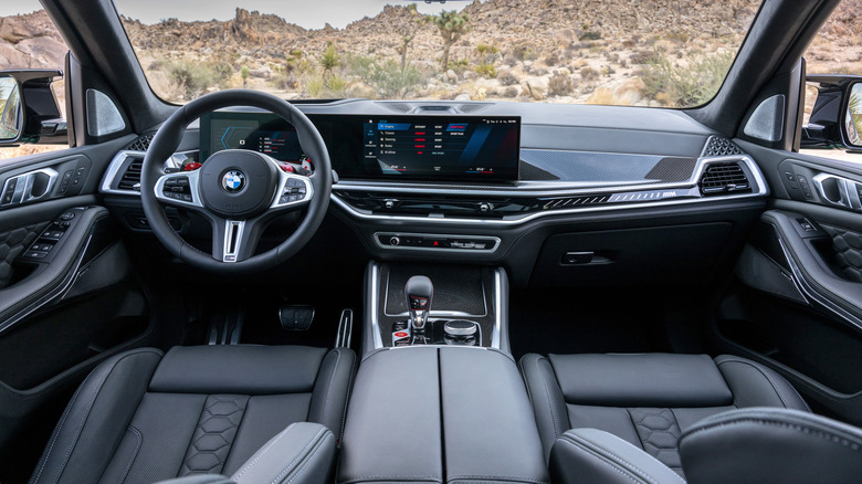 Interior view of a BMW X5 from the rear seats.