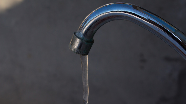 A kitchen faucet with ice dripping instead of water