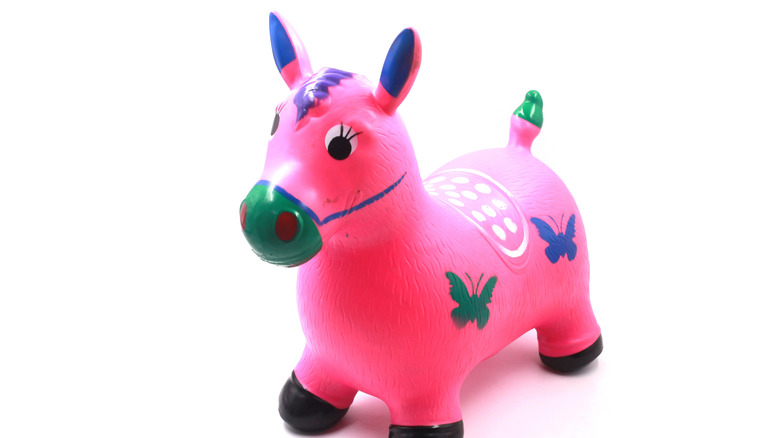 A colorful toy horse against white background