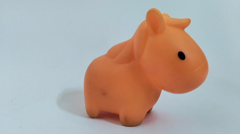 A small rubber horse toy