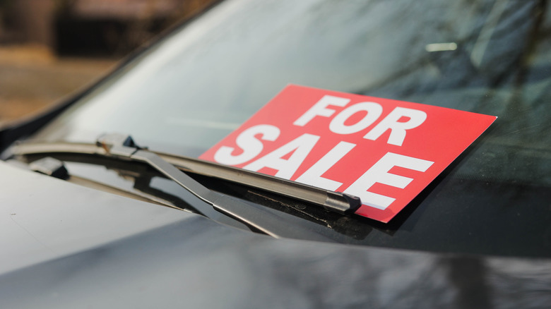 for sale sign on car windshield