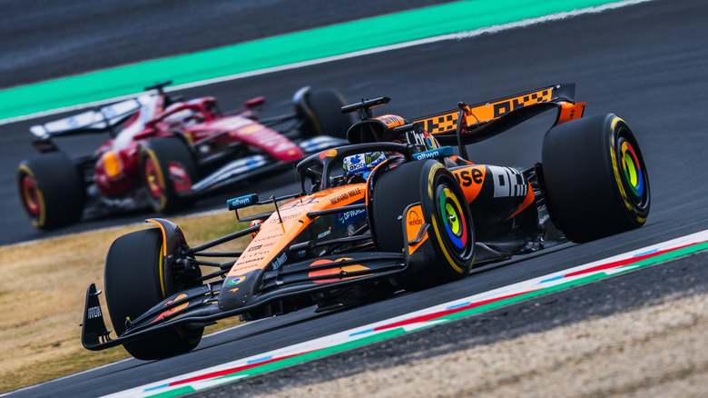 Lando Norris ahead of a Ferrari car at the 2025 Japanese Grand Prix