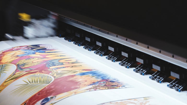 Printer printing a colorful design on white paper
