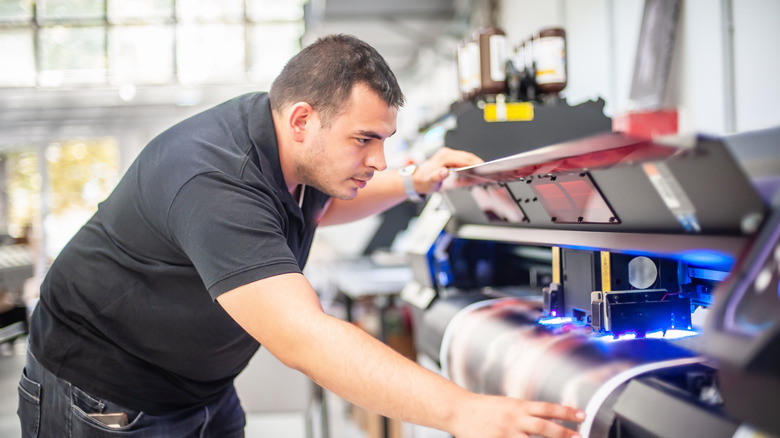 Man using a UV printer