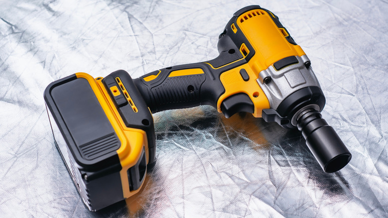 Cordless yellow colored impact wrench