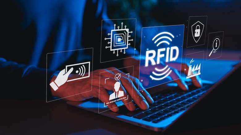 Person at laptop with digital graphics popping up in midair