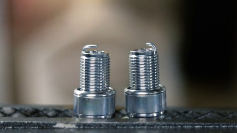 Stock and side-gapped spark plugs next to each other