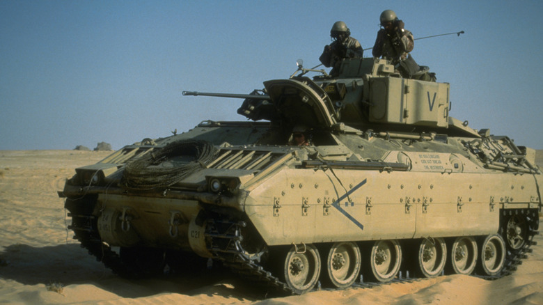 An M2 Bradley Fighting Vehicle parked in sand
