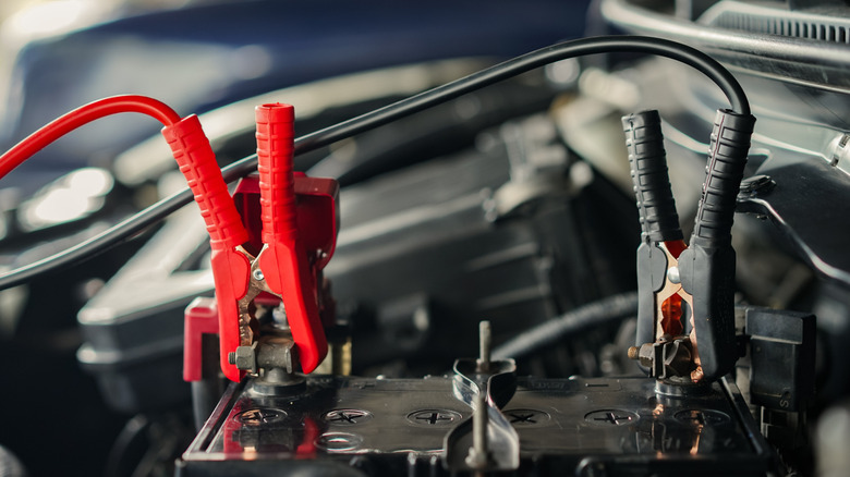 Jumper cables on a car battery