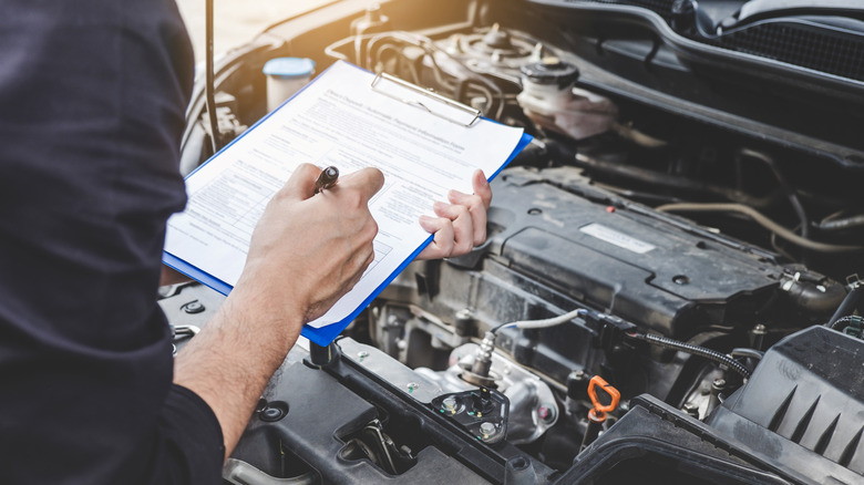 Mechanic inspecting a car