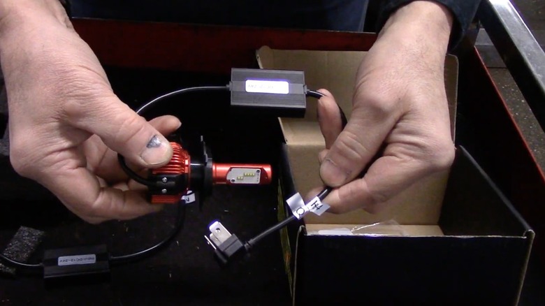 a mechanic unboxes an led conversion kit