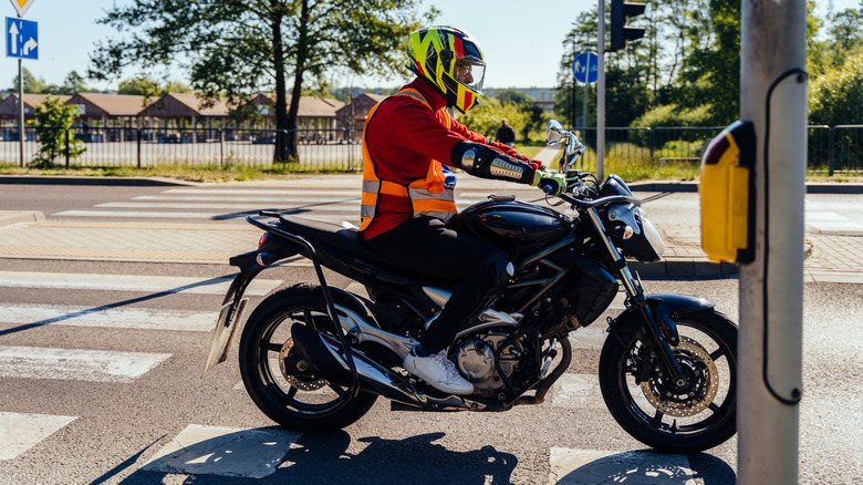 Motorcycle rider at traffic lights.